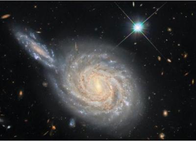 تصویر شگفت انگیر هابل از دو کهکشان در حال برخورد!